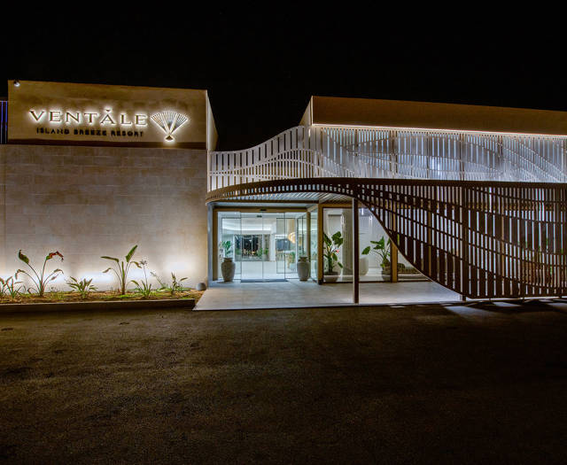 Ventale Island Breeze Resort entrance lit up at night