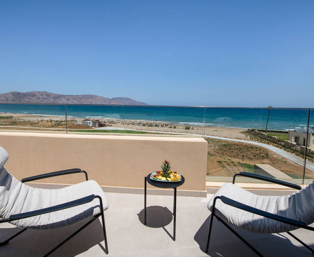 Ventale Island Breeze Resort Sky Junior Suite Sea View balcony with two armchairs and sea view